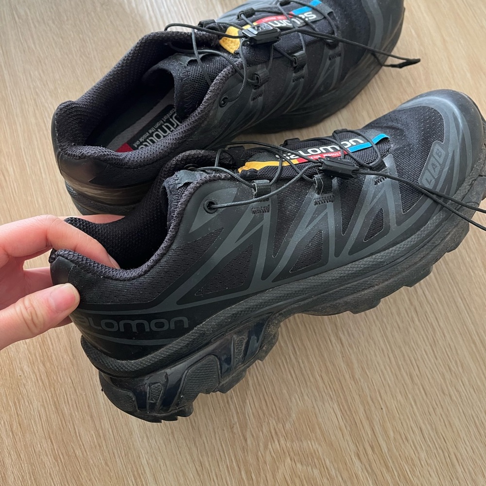 Salomon Black Trail Running Sneakers with Subtle Yellow & Blue Accents